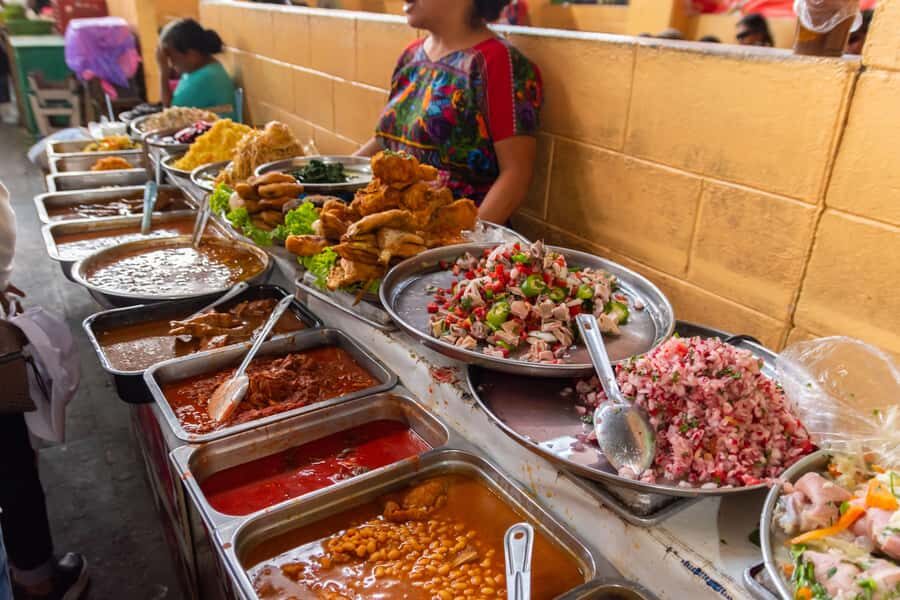 Antigua Guatemala: Street Food Walking Tour with Tastings - Market fruit, local shopping habits, and the Mayan gold stop