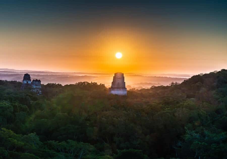 From Flores: Tikal Ruins Sunrise Guided Tour - Guided ruins walk: pyramids, palaces, and pan views
