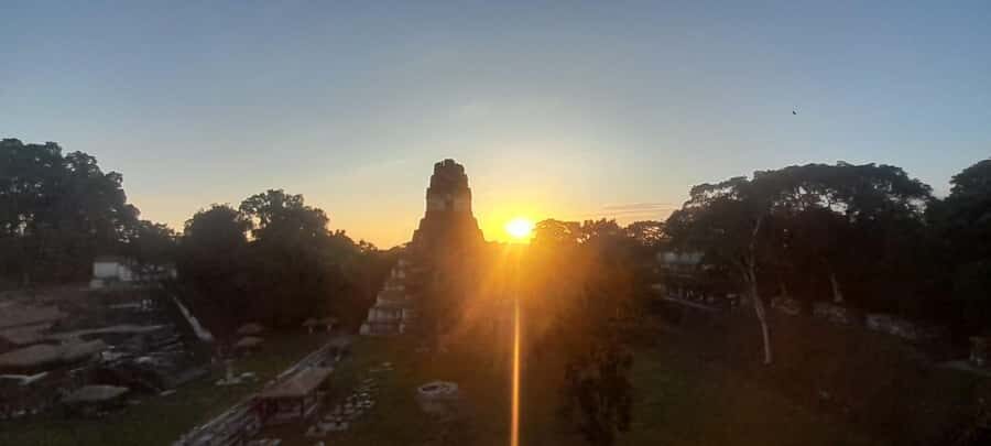 From Flores: Tikal Sunset Tour - The Lost World Pyramid Climb for a 360° Sunset View